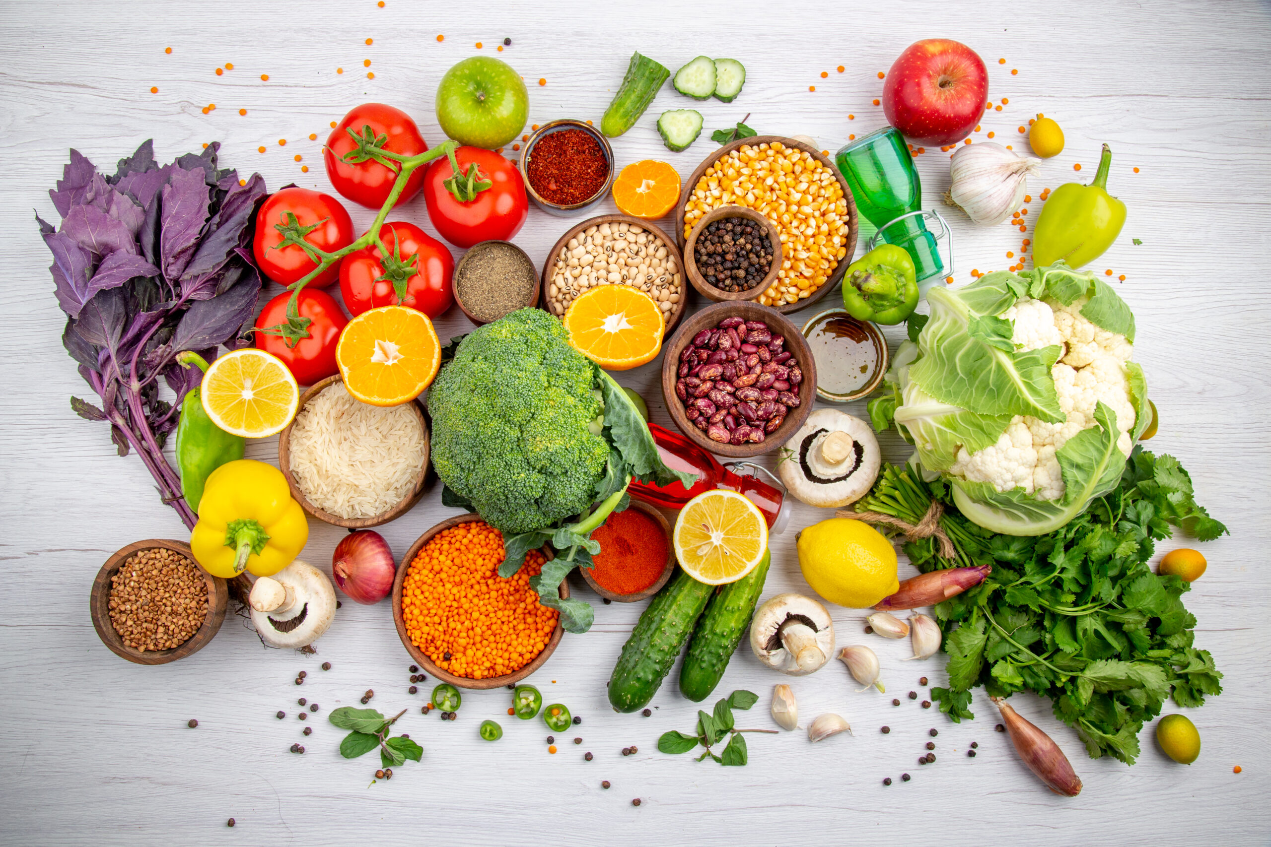 top-view-of-fresh-foods-and-spices-vegetables-for-cooking-on-white-table